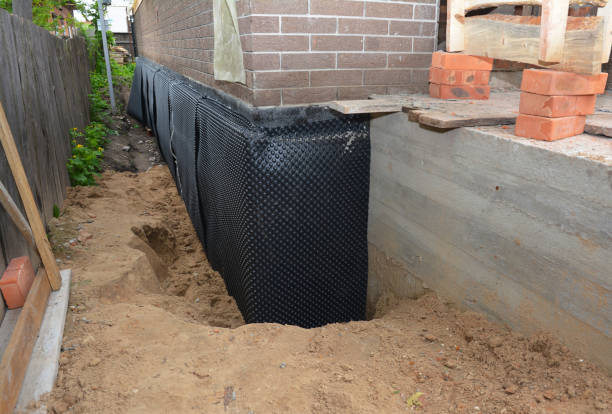 Happy homeowners after waterproofing job in Alfred Station